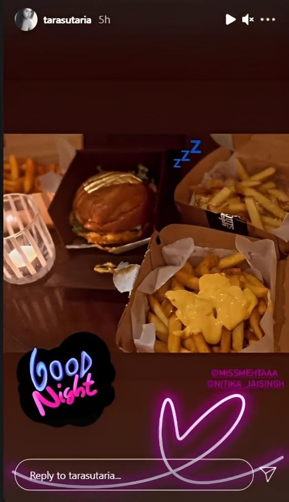 When in doubt, eat a burger! Tara Sutaria knows how to savor every bite with a smile